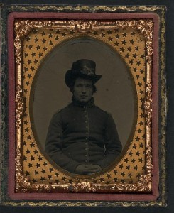 Unidentified young Union soldier in infantry shell jacket with shoulder scales and Company E Hardee hat