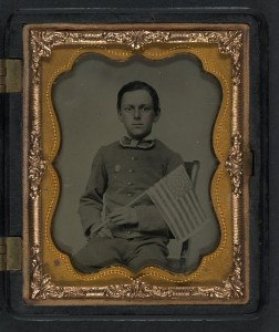 Unidentified boy holding 34-star flag (between 1861 and 1865; LOC - LC-DIG-ppmsca-27367)