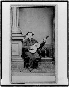 Civil War soldier, with one leg, full-length portrait, seated, facing front, holding guitar (between 1861 and 1880; LOC: LC-USZ62-119585)
