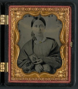 Unidentified woman holding a cased photograph of an unidentified solder in Confederate uniform (between 1861 and 1865; LOC: v)