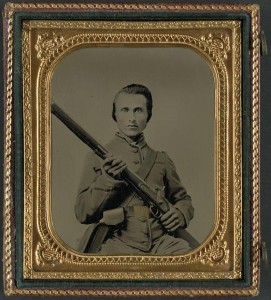 Unidentified soldier in Confederate uniform and Louisiana state seal belt buckle with musket (between 1861 and 1865; LOC: LC-DIG-ppmsca-31314)