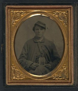 Freeman Mason of Company K, 17th Vermont Infantry holding a tintype of his brother, Michael Mason, killed at Savage's Station, Virginia, in 1862 (between 1864 and 1865; LOC: LC-DIG-ppmsca-37071)