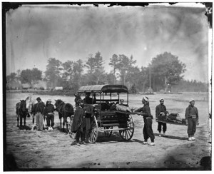 Unknown location. Zouave ambulance crew demonstrating removal of wounded soldiers from the field; another view (Between 1860 and 1865; LOC: LC-DIG-cwpb-04095)