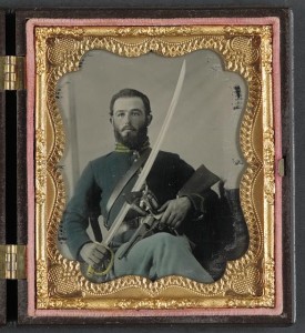 Unidentified soldier in Union uniform with stocked Colt pistol, Remington, and cavalry saber (V; LOC:  LC-DIG-ppmsca-32685)