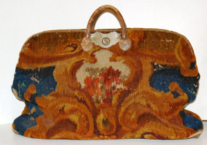 Carpetbag (American carpetbag circa 1860; wool with leather handles.)