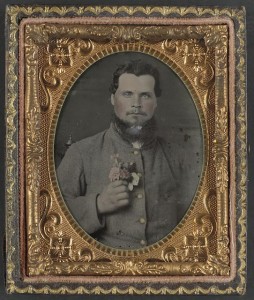 [Unidentified soldier in Confederate uniform with bouquet of flowers] (between 1861 and 1865; LOC: LC-DIG-ppmsca-33309)