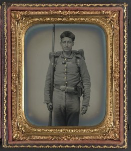 Unidentified soldier in Ohio Volunteer Militia uniform with bedroll and musket (between 1861 and 1865; LOC: LC-DIG-ppmsca-37409)