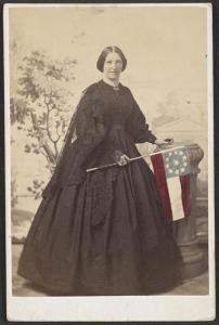 Mrs. Ridgley Brown (	Photograph shows Mrs. Ridgley (or Ridgely?) Brown, possibly the wife of Lieutenant Colonel Ridgely Brown of Co. K, 1st Virginia Cavalry Regiment, and Co. A, 1st Maryland Cavalry Battalion, holding 11-star Confederate flag, between 1861 and 1865; LOC:  LC-DIG-ppmsca-38065)
