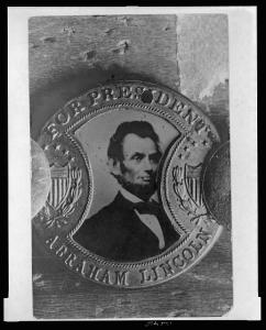 Photograph of a campaign button with portrait of Abraham Lincoln and inscription "For President Abraham Lincoln" (1864, printed later; LOC:  LC-USZ62-126415)
