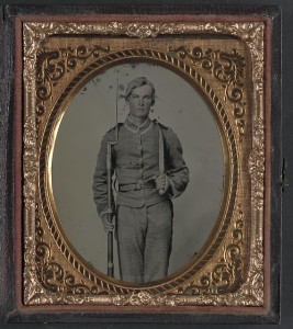 Unidentified soldier in Confederate uniform with musket and D-guard Bowie knife (between 1861 and 1865; LOC: LC-DIG-ppmsca-32047)
