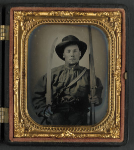 Unidentified soldier in Confederate uniform with double barrel shotgun, Bowie knife, and two pistols (between 1861 and 1865; LOC: http://www.loc.gov/item/2015645466/)