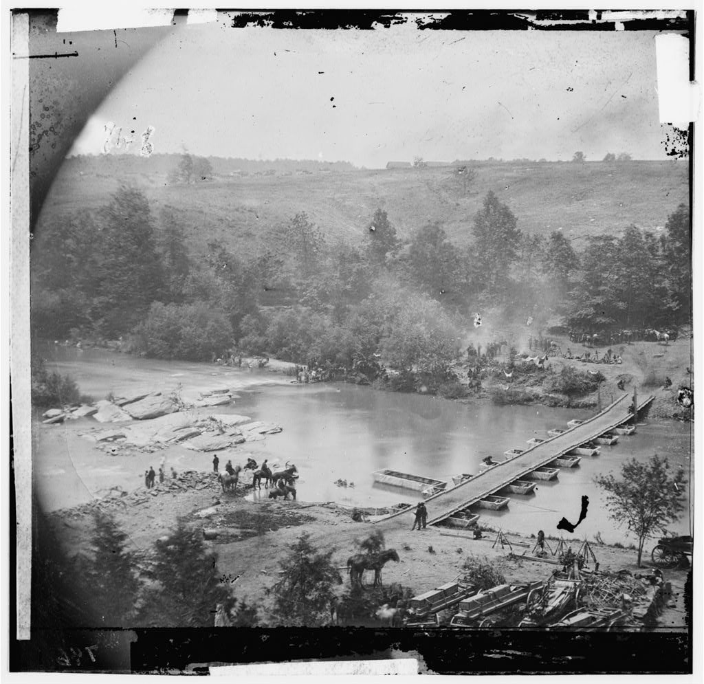 Jericho Mills, Va. Canvas pontoon bridge across the North Anna, constructed by the 50th New York Engineers; the 5th Corps under Gen. Gouverneur K. Warren crossed here on the 23d. View from the north bank (by Timothy H. O'Sullivan; 1864; LOC: http://www.loc.gov/item/cwp2003000481/PP/)