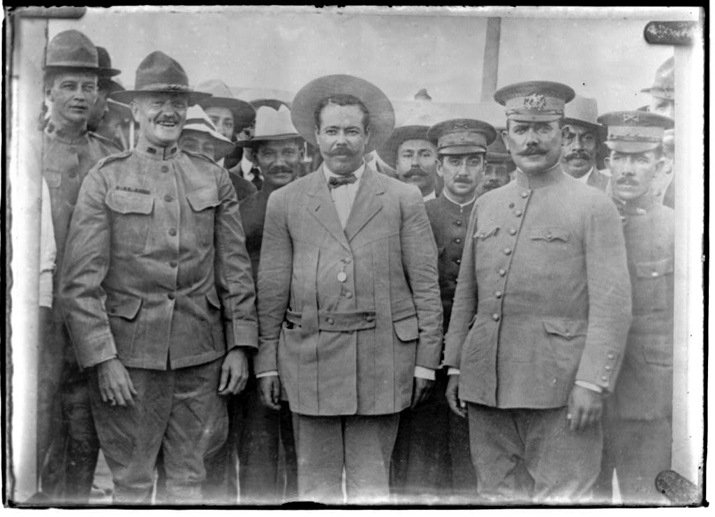  Generals Obregon, Villa and Pershing meet at Ft Bliss, TX (1). Immediately behind Pershing on the left is his aide Lt. George S. Patton. (https://memory.loc.gov/ammem/today/jul15.html)