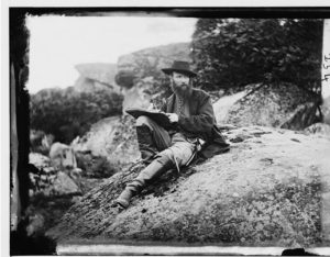 [Gettysburg, Pa. Alfred R. Waud, artist of Harper's Weekly, sketching on battlefield] (by Timothy H. O'Sullivan, 1863 July; LOC: https://www.loc.gov/item/cwp2003000198/PP/)