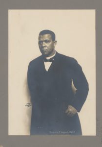 Booker T. Washington, half-length portrait, standing, against white background (LOC: https://www.loc.gov/item/98502189/)