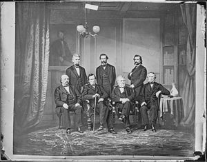 Members of Impeachment Committee: Hon. John Bingham, Ohio, Hon. Thaddeus Stevens, Pa., Hon. John A. Logan, Hon. Thomas Williams, Pa., Hon. James F. Wilson. (Sitting - Gen. Butler, Thaddeus Stevens, Thomas Williams, John Bingham. Standing - James F. Wilson, George S. Boutwell) (National Archives: https://catalog.archives.gov/id/528559)