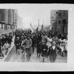 Paris. Everybody nearly yelled their heads off an Armistice Day in Paris, November 11th, 1918. Here they are, children and grownups, singing the Marseillaise, marching about the streets (United States Army Signal Corps, photographer; 11 November 1918.; LOC: https://www.loc.gov/resource/anrc.00498/)