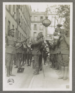 Genuine jazz for the yankee wounded In the courtyard of a Paris hospital for the American wounded, an American negro military band, led by Lt. James R. Europe, entertains the patients with real American jazz. (1918; LOC: https://www.loc.gov/item/2016651602/)